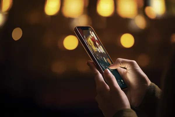 A close-up shot of golden coins falling around a spinning roulette wheel, representing immersive casino action at ZBZBET.