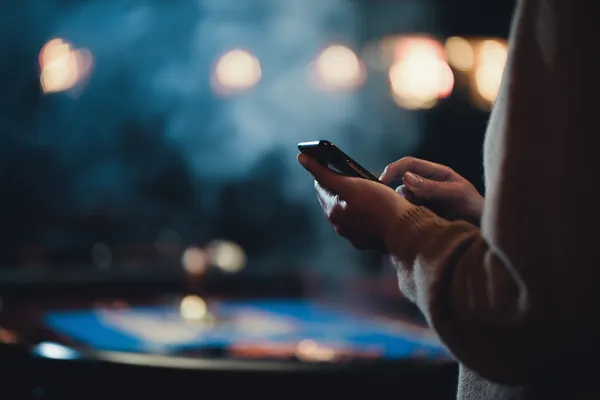 A glowing roulette wheel with cascading chips, symbolizing the engaging live and instant-win games available on ZBZBET.